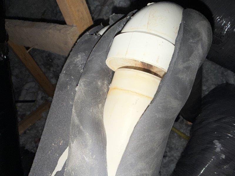 Responded to service call regarding humidifier malfunction and condensation leak. Upon inspection, discovered PVC elbow joint in attic above furnace was not properly glued, causing condensation to leak from the venting system. Applied PVC cement to secure the elbow connection and prevent future moisture issues. Addressed customer concerns about humidifier operation and discussed potential filter replacement needs. Also identified venting configuration from roof to garage that was contributing to moisture buildup in the system.