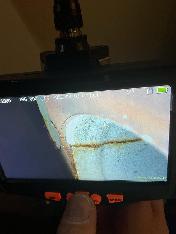 Responded to no heat call and diagnosed failed pressure switch causing furnace malfunction. Furnace was recirculating flue gas due to pressure switch failure, creating unsafe operating conditions. Replaced defective pressure switch and restored unit to proper operation. Inspection revealed significant rust and corrosion on flue pipe and roof jack assembly. Used borescope camera to document interior pipe conditions showing advanced deterioration and mineral deposits. Recommended complete roof jack replacement to address corrosion issues and ensure safe venting of combustion gases.
