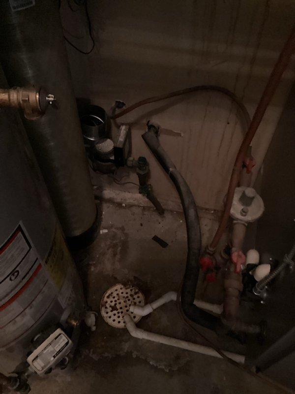 Disconnected and relocated water softener brine tank and associated plumbing components to provide utility company access for water meter replacement. Temporarily moved equipment away from work area to accommodate meter installation scheduled for same day. Return visit will be required to reinstall and reconnect the brine tank system once utility work is completed.