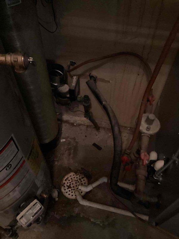 Disconnected and relocated water softener brine tank and associated plumbing components to provide utility company access for water meter replacement. Temporarily moved equipment away from work area to accommodate meter installation scheduled for same day. Return visit will be required to reinstall and reconnect the brine tank system once utility work is completed.