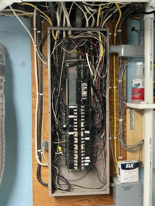 Conducted electrical safety assessment of century-old residential property requiring comprehensive GFCI outlet and wiring upgrades throughout the home. Inspected existing electrical panel and identified complete absence of arc fault circuit interrupter (AFCI) protection on all branch circuits. Provided detailed estimate for whole-home surge protection system installation and recommended specific breakers requiring conversion to AFCI protection per current electrical code requirements. Documented existing panel configuration, ceiling cavity wiring conditions, and structural access points for future upgrade implementation.