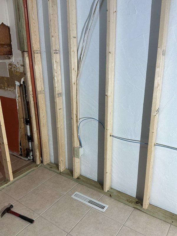 Completed return appointment to wire and install two outlets in newly framed basement wall. Electrical wiring had been properly run by framing crew through stud cavities with foam insulation panels installed. Landed all wires in outlet boxes, terminated connections, and installed receptacles into boxes to complete the electrical installation.
