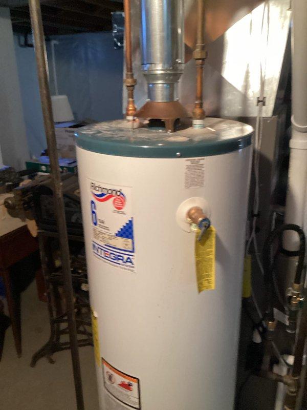 Responded to no hot water complaint and confirmed existing tanked water heater had failed and was no longer producing hot water. Performed on-site assessment of the unit and surrounding plumbing configuration in basement utility area. Provided estimate for replacement with new 40-gallon atmospheric vent natural gas water heater, including all necessary connections and venting components.