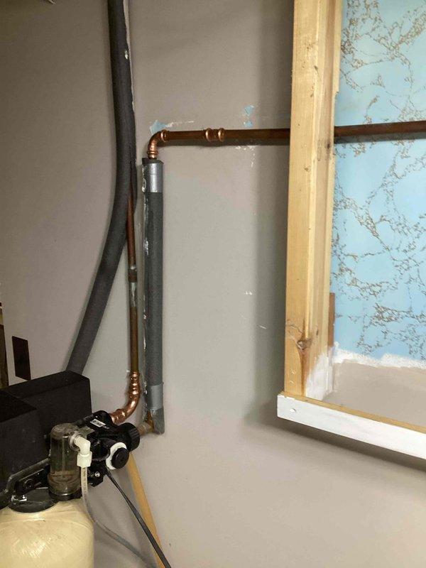 Responded to a leaky pipe emergency and located a pin hole leak in the 1/2" copper supply line coming from the water softener. Cut out the damaged section of copper piping and installed new copper pipe with proper fittings. Tested the system upon completion and verified all connections were secure with no leaks present and proper water flow restored.