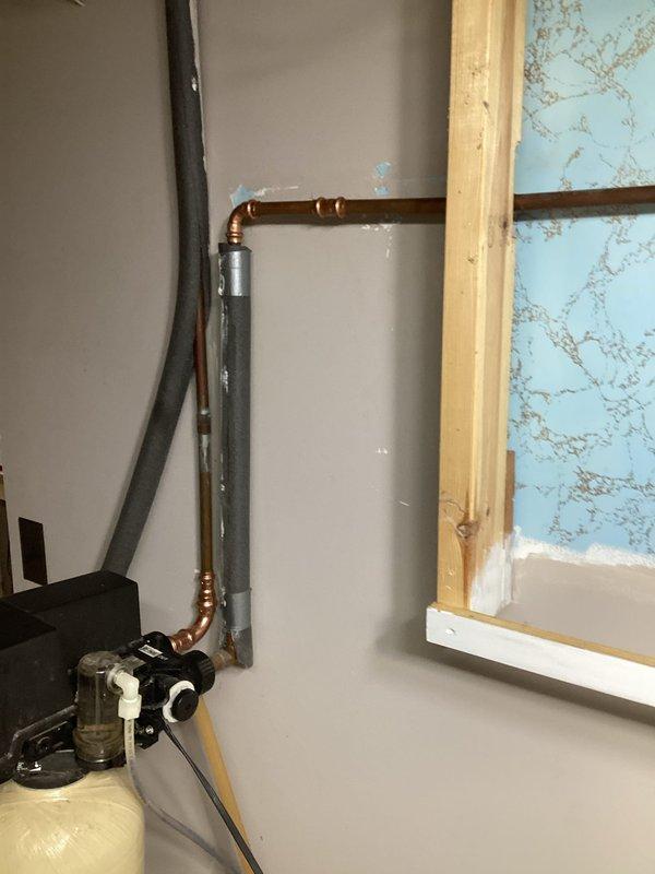 Responded to a leaky pipe emergency and located a pin hole leak in the 1/2" copper supply line coming from the water softener. Cut out the damaged section of copper piping and installed new copper pipe with proper fittings. Tested the system upon completion and verified all connections were secure with no leaks present and proper water flow restored.