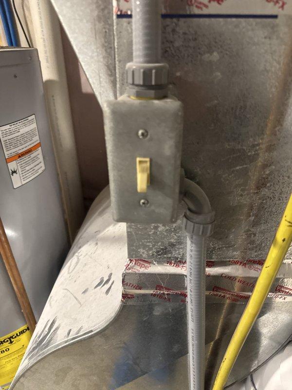 Responded to no heat call and discovered water accumulation in furnace blower assembly and inducer motor due to improperly installed condensate drain line. Found drain line routing error causing secondary drain pan to overflow and allowing carbon monoxide to leak through apartment drain system. Unit was immediately shut down and red-tagged for safety due to CO hazard and water damage to critical components. Provided estimate for corrective repairs including proper drain line installation and component assessment.