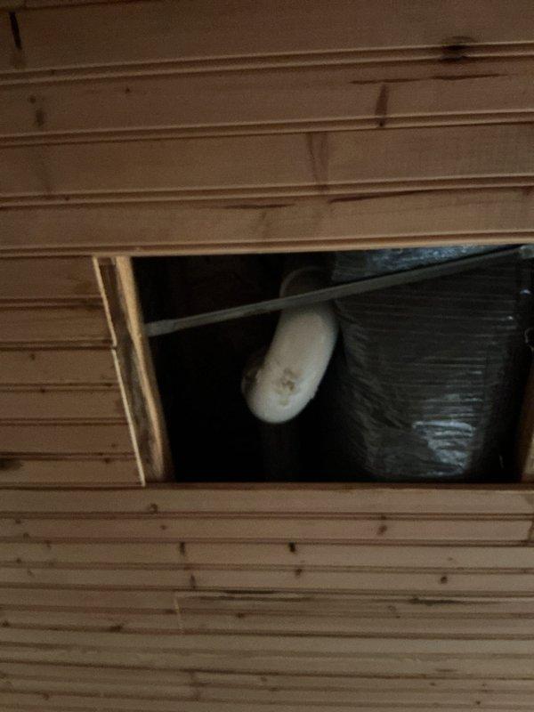 Responded to emergency call for reported water leak originating from either shower drain or refrigerator supply line. Upon arrival, temporarily shut off main water supply to house to stop active leaking. Conducted thorough inspection of plumbing fixtures, accessed ceiling cavity to examine pipes and potential leak sources. Unable to locate active leak during inspection period. Restored water service to residence and advised property occupant to monitor situation and note which fixtures are in use if leaking recurs to help isolate source.