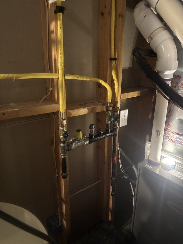 Responded to gas leak at fireplace supply line traced back to main gas line connection point. Removed faulty connection fitting and installed new connection with code-compliant shut-off valve added to the gas line serving the fireplace. Performed pressure test on the repaired line to verify system integrity and confirm no additional leaks present. All work completed in accordance with applicable gas code requirements.
