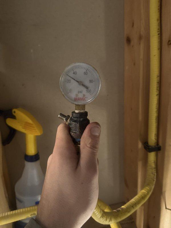 Responded to gas leak at fireplace supply line traced back to main gas line connection point. Removed faulty connection fitting and installed new connection with code-compliant shut-off valve added to the gas line serving the fireplace. Performed pressure test on the repaired line to verify system integrity and confirm no additional leaks present. All work completed in accordance with applicable gas code requirements.