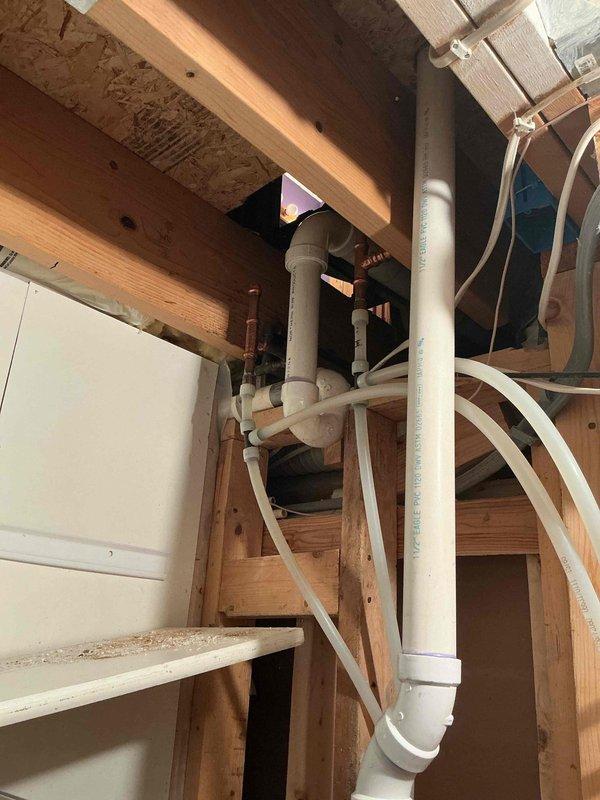 Installed dedicated electrical circuit for newly installed jet tub, running wiring from main breaker panel through bathroom, under stair storage area, and back up into bathroom to supply new outlet. Completed circuit installation and outlet mounting to provide proper power supply for jet tub operation.