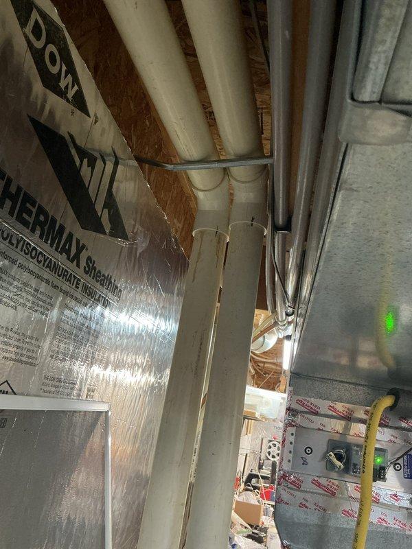 Responded to service call regarding furnace exhaust pipe freezing during winter operation. Upon inspection, determined that both the exhaust and intake PVC pipes lacked proper insulation, allowing condensation to freeze in cold weather conditions. Installed insulation on both the exhaust and intake piping to prevent future freezing issues and ensure proper system operation throughout winter months.