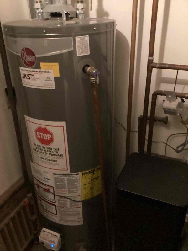 Responded to service call for leaking kitchen faucet and water heater issues. Upon inspection, determined the kitchen faucet was beyond repair due to failed sprayer mechanism and internal damage. Removed existing faucet assembly and installed new replacement unit, completing all supply line connections and testing for proper operation and leak-free performance. Additionally, identified a faulty temperature and pressure relief valve on the tanked water heater that was actively leaking. Removed the defective T&P valve and installed new valve, ensuring proper threading and seal. Verified all repairs were functioning correctly with no leaks present at kitchen sink or water heater upon completion.