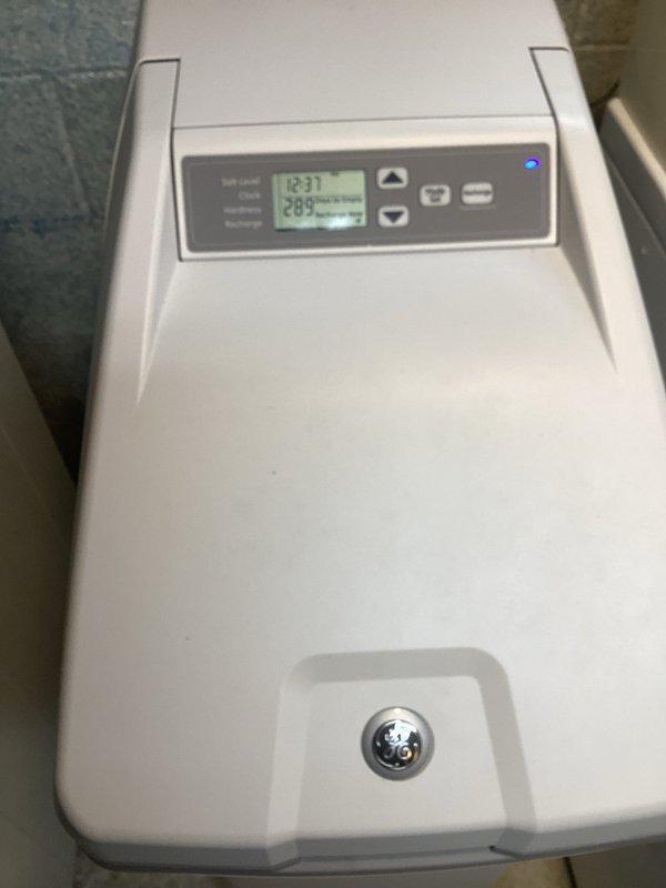 Responded to service call for water softener functionality concerns on unit installed in 1997. Performed manual regeneration cycle and conducted water hardness testing. Test results confirmed softener operating at optimal performance with hardness level measuring 3 ppm, well within acceptable parameters for properly functioning system.