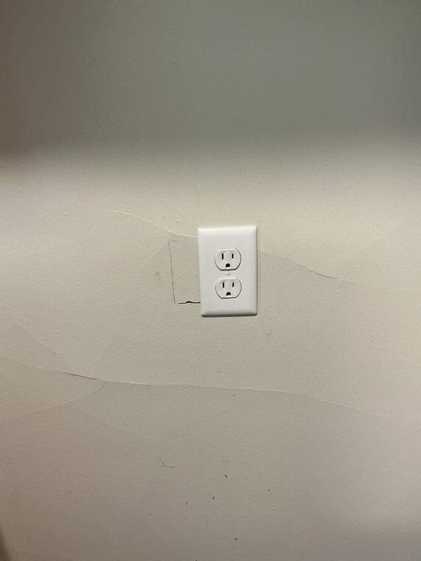Installed a dedicated 20-amp circuit with new outlet for refrigerator to meet current electrical code requirements. Relocated existing stove outlet by adjusting its position on the wall, allowing the electric range to fit flush against the wall without obstruction. All work completed with power verified and appliances tested for proper operation.