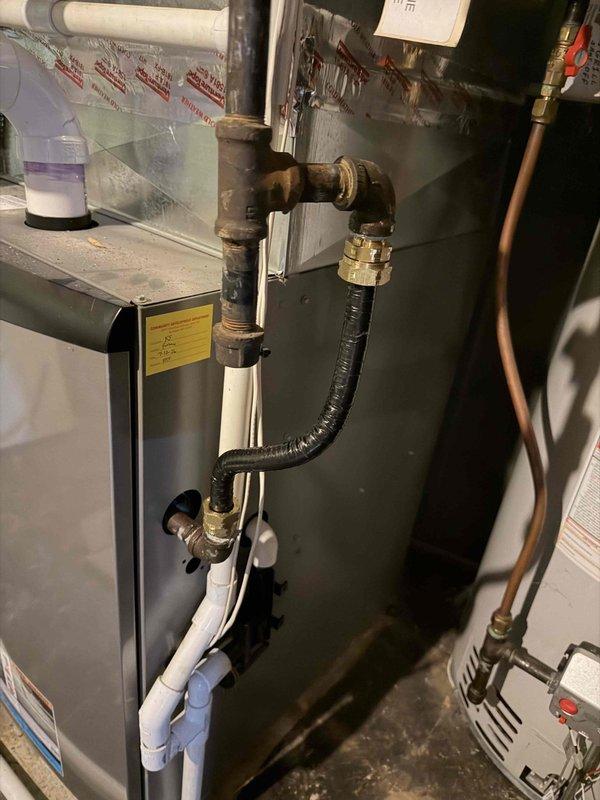 Responded to failed inspection citation for non-compliant gas connector on furnace installation. Removed unlisted and unlabeled corrugated gas connector material that did not meet code requirements. Installed approved gas line connection with proper brass fittings and code-compliant flexible connector. Verified all connections for proper fit and tested system for gas leaks. System restored to safe operating condition and brought into compliance with current gas piping standards.