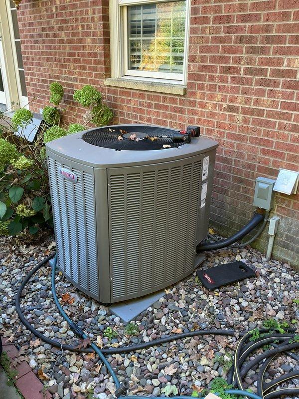 Responded to service call for outdoor condensing unit experiencing operational issues. Upon inspection, discovered rodent damage to critical electrical components including defrost wire and thermal overload protection wiring. Replaced faulty inverter board kit under warranty coverage. Completed installation of new inverter board and addressed all damaged wiring connections caused by rodent intrusion. Unit tested and restored to normal operation. Documented existing conditions with photographs showing compressor assembly, electrical connections, and overall equipment placement on exterior pad with proper clearances maintained.