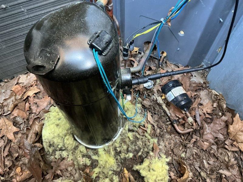 Responded to service call for outdoor condensing unit experiencing operational issues. Upon inspection, discovered rodent damage to critical electrical components including defrost wire and thermal overload protection wiring. Replaced faulty inverter board kit under warranty coverage. Completed installation of new inverter board and addressed all damaged wiring connections caused by rodent intrusion. Unit tested and restored to normal operation. Documented existing conditions with photographs showing compressor assembly, electrical connections, and overall equipment placement on exterior pad with proper clearances maintained.