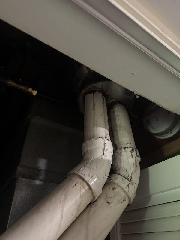 Responded to water intrusion issue affecting Lennox furnace exhaust system during rainfall. Upon inspection, identified compromised roof sealant at flue pipe penetration allowing water infiltration. Resealed roof penetration points, removed wasp nest obstruction from exhaust piping, and performed full system operational test confirming no water damage to furnace components and proper venting function.