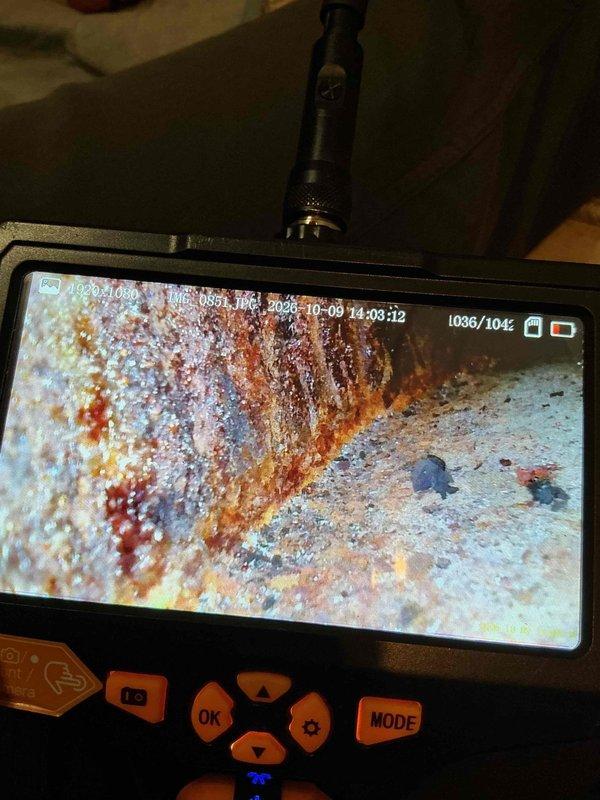 Responded to emergency service call for high carbon monoxide levels detected by gas company at tenant-occupied property. Upon arrival, performed comprehensive diagnostic inspection of furnace system. Utilized borescope inspection camera to examine internal heat exchanger components, revealing extensive rust and corrosion throughout the heat exchanger assembly. Visual inspection confirmed catastrophic failure of heat exchanger with visible deterioration and compromised structural integrity, creating dangerous conditions for CO leakage into living space. Due to severity of heat exchanger failure and associated safety hazards, condemned existing furnace unit and recommended immediate replacement. Complete furnace replacement required to restore safe heating operation and eliminate carbon monoxide risk.