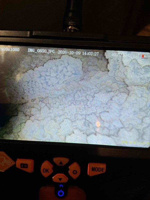 Responded to emergency service call for high carbon monoxide levels detected by gas company at tenant-occupied property. Upon arrival, performed comprehensive diagnostic inspection of furnace system. Utilized borescope inspection camera to examine internal heat exchanger components, revealing extensive rust and corrosion throughout the heat exchanger assembly. Visual inspection confirmed catastrophic failure of heat exchanger with visible deterioration and compromised structural integrity, creating dangerous conditions for CO leakage into living space. Due to severity of heat exchanger failure and associated safety hazards, condemned existing furnace unit and recommended immediate replacement. Complete furnace replacement required to restore safe heating operation and eliminate carbon monoxide risk.