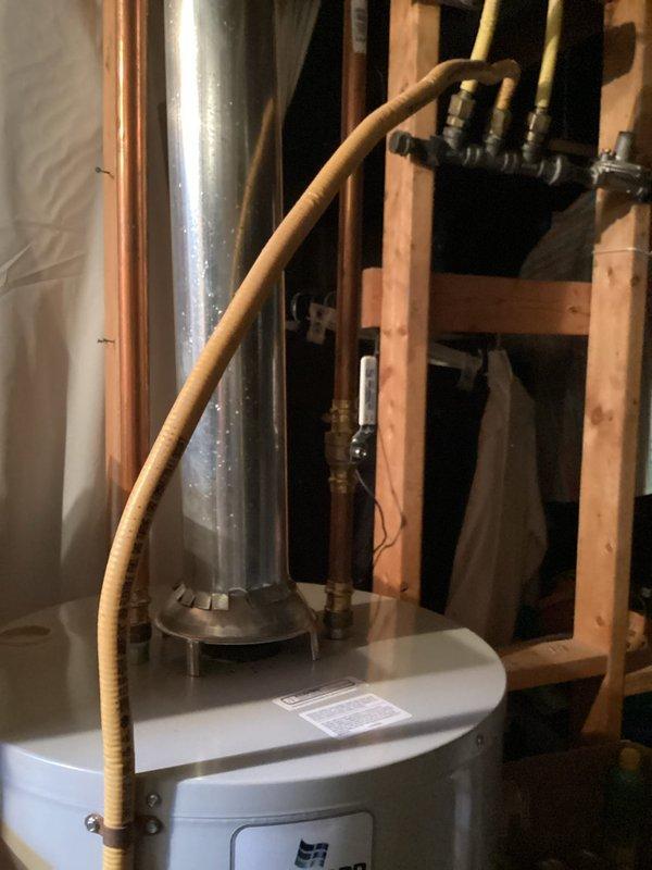 Responded to callback for atmospheric water heater vent correction. Upon inspection, identified improper pitch on the vent pipe that was not facilitating proper natural draft. Lowered and repositioned the atmospheric vent on the Bradford White water heater to achieve correct upward pitch, ensuring compliance with venting standards and proper exhaust function.