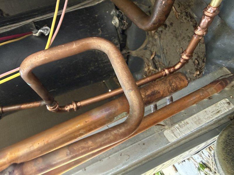 Responded to service call for refrigerant leak on HVAC system. Installed service valve on copper refrigerant line to facilitate proper system access and diagnostics. Successfully located and repaired refrigerant leak at pipe connection point, restoring system integrity and preventing further refrigerant loss.