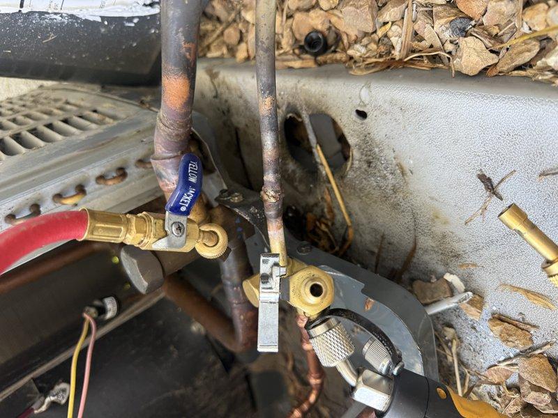 Responded to service call for refrigerant leak on HVAC system. Installed service valve on copper refrigerant line to facilitate proper system access and diagnostics. Successfully located and repaired refrigerant leak at pipe connection point, restoring system integrity and preventing further refrigerant loss.