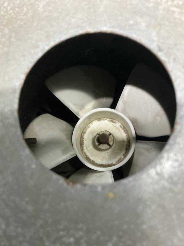 Responded to service call for furnace making grinding noise prior to ignition. Diagnosed inducer motor as source of noise and discovered large accumulation of dust and debris in inducer motor housing. Cleaned inducer motor housing thoroughly, removed all debris, and replaced blower motor capacitor to restore proper system operation.