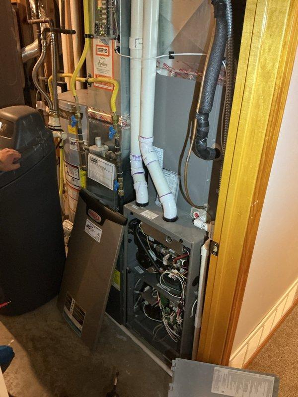 Responded to no cooling complaint on Lennox heat pump system. Found outdoor fan not operating in cooling mode with intermittent metallic clicking from outdoor unit. Diagnosed reversed thermostat power wiring and failed contactor coil. Corrected thermostat wiring polarity and replaced defective contactor coil under warranty. System tested and confirmed operational in cooling mode with proper outdoor fan operation.