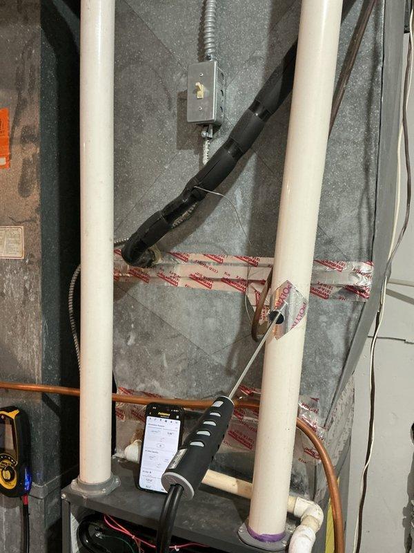 Completed comprehensive air handler tune-up maintenance service with no issues identified. Performed standard inspection and preventive maintenance procedures on system located in mechanical room, verified all components operating within normal parameters, and confirmed proper refrigerant line connections and electrical terminations.