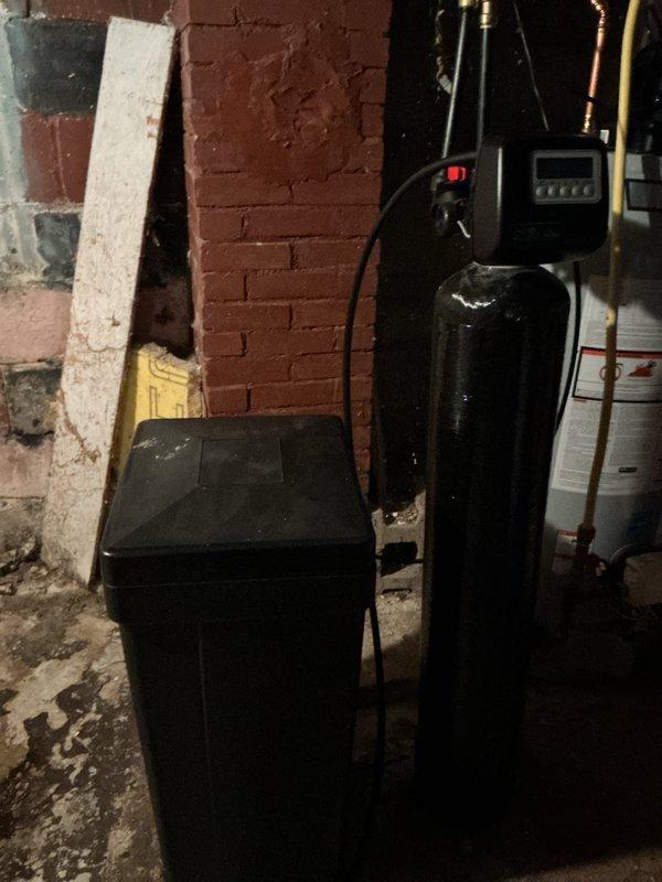 Responded to service call regarding a three-year-old water softener unit experiencing intermittent refill issues following regeneration cycles. Upon arrival, conducted comprehensive system inspection including examination of brine tank, resin tank, control valve assembly, and associated plumbing connections. Tested regeneration cycle operation and monitored fill mechanism performance. All components found functioning within normal parameters with no mechanical defects or malfunctions detected. Provided detailed operational overview to occupant, explaining proper regeneration cycle sequence, brine tank fill process, and normal system sounds during operation. System confirmed operational and left in service.