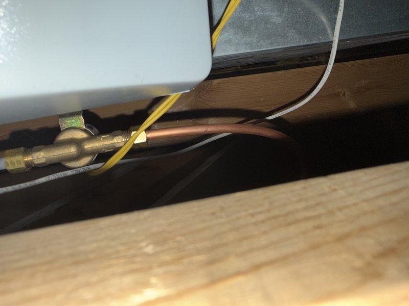 Installed zone damper actuators on the supply ductwork and connected the low-voltage control wiring to the zone control system. Also ran a copper water supply line with a brass compression-fitting shutoff valve to the humidifier. Verified damper operation and secure connections upon completion.