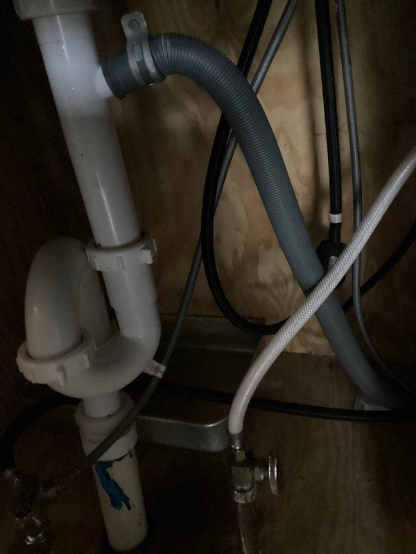 Responded to a callback for a persistent leak under the kitchen sink and found the drain tailpiece had come loose. Repositioned the trap higher on the tailpiece and securely tightened all compression nuts. Ran the faucet for two minutes to verify the repair, with no leaks observed.