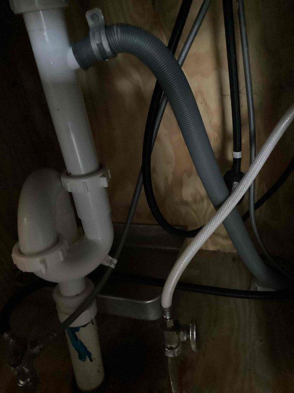 Responded to a callback for a persistent leak under the kitchen sink and found the drain tailpiece had come loose. Repositioned the trap higher on the tailpiece and securely tightened all compression nuts. Ran the faucet for two minutes to verify the repair, with no leaks observed.