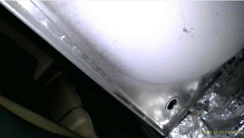 Responded to a no-heat complaint and verified the thermostat and system were operating properly. Borescope inspection of the 10+ year-old furnace revealed a cracked eyelet at the heat exchanger, along with rust and corrosion around the port opening. Recommended heat exchanger or furnace replacement due to the compromised heat exchanger.