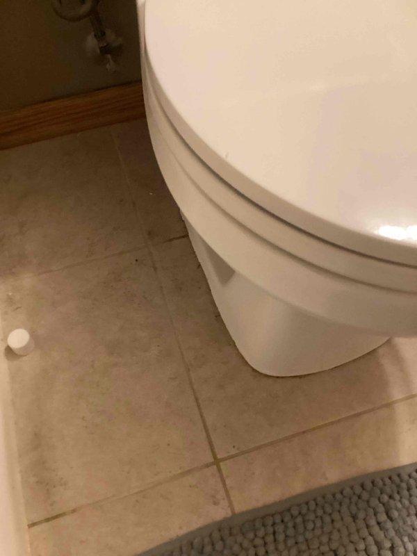 Traced a water leak in the laundry room to the hallway bathroom directly above, where the toilet was leaking at the base when flushed. Removed the toilet, installed a new wax ring and closet bolts, then reset and secured the toilet to the flange. Flushed multiple times to verify a proper seal, with no further leaks observed.