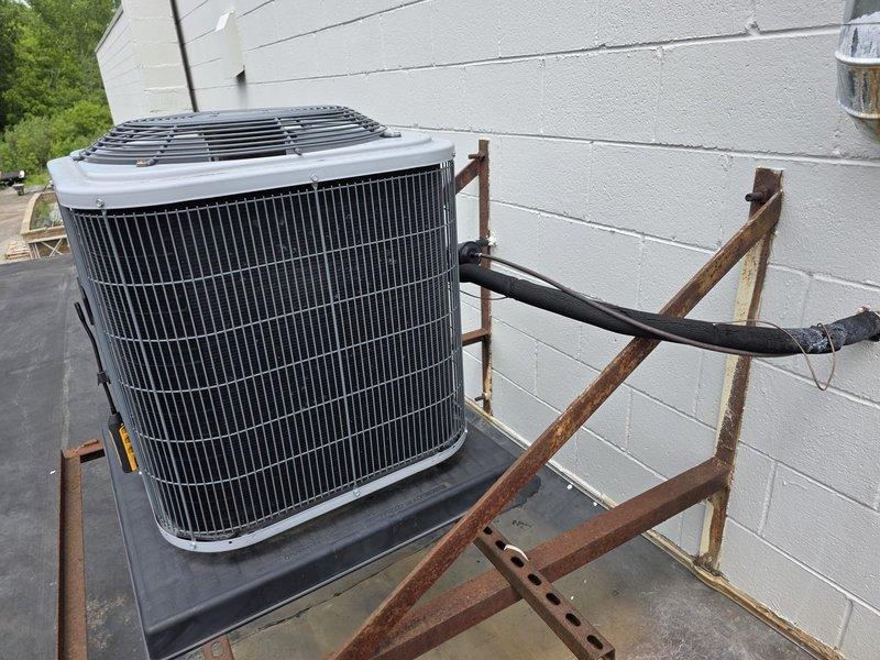 Responded to non-cooling complaint on 6-year-old Heil model N4A330GKG101 air conditioning unit located on rooftop. Upon arrival, confirmed unit was running with blower operational but no cooling output. Performed diagnostic evaluation by accessing electrical compartment and inspecting internal components including contactors, capacitor, and wiring connections. Verified equipment specifications and reviewed manufacturer documentation to ensure proper system operation parameters for this 2.5-ton residential air conditioner.