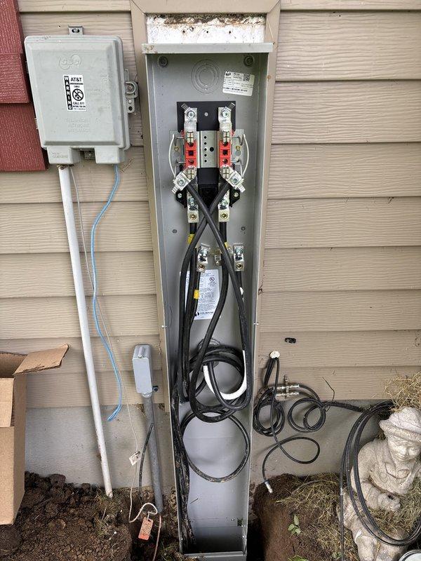 Beaver Dam, WI - Completed a full 200-amp underground electrical service upgrade with installation of a new 60-space main panel. Coordinated utility disconnect with power company at 8:00am and deployed backup generator to maintain power to the residence throughout the workday, as the homeowner required uninterrupted service. Removed existing electrical service equipment and installed new 200A underground service infrastructure, including meter base, main disconnect panel, and associated conduit and wiring. Excavated and installed underground electrical service entrance conductors per code requirements. Successfully passed municipal electrical inspection. All work completed in accordance with permit specifications and NEC standards, with power fully restored to the upgraded system.