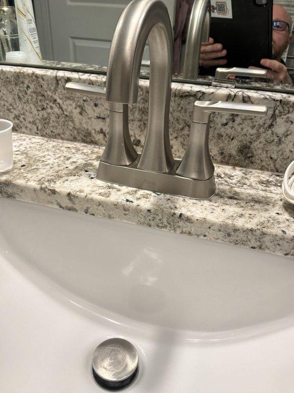 Completed PLUM Member Check Up on residential property built in 2018. Verified Bradford White water heater model RG2PV50T6N (serial SE41501452), installed June 2018, currently 8 years old and operating within normal parameters. Inspected bathroom plumbing fixtures including sink faucet assembly, supply lines, shut-off valves, and drain trap configuration; all components found in good working condition with no leaks or deficiencies noted.