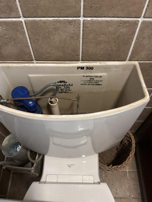 Completed PLUM Member Check Up on 1950 home with 20-30 minute availability window and text communication protocol. Verified and documented 15-year-old GE water heater (Model: GG50T06PVT, Serial: GELN0311V09052, installed March 2011). Inspected utility sink showing heavy mineral deposits, staining, and accumulated debris in basin with functional drainage system and PVC plumbing connections. Examined Mansfield toilet tank internal components including PM 300 flapper valve assembly, float mechanism, and flush valve system in proper working condition. Documented all equipment conditions and plumbing fixtures through photographic record for member maintenance files.
