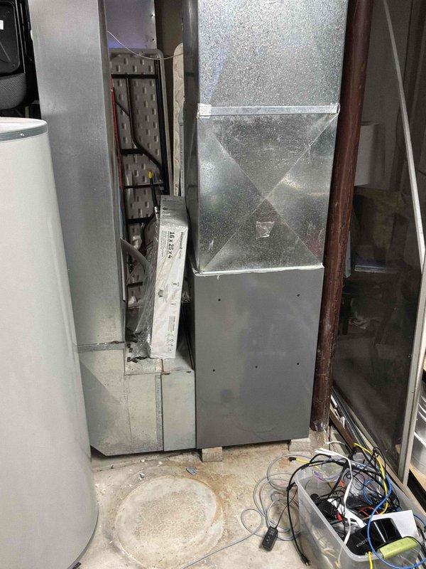 Responded to cooling complaint where residence was reaching 80 degrees with inconsistent airflow from supply vents and elevated humidity levels. Performed diagnostic evaluation on 7-year-old Rheem RA1348AJ1NA air conditioning unit and 5-year-old Rheem R96VA1002521MSA gas furnace system, inspecting equipment operation, airflow distribution, and electrical panel connections to identify cause of inadequate cooling performance.