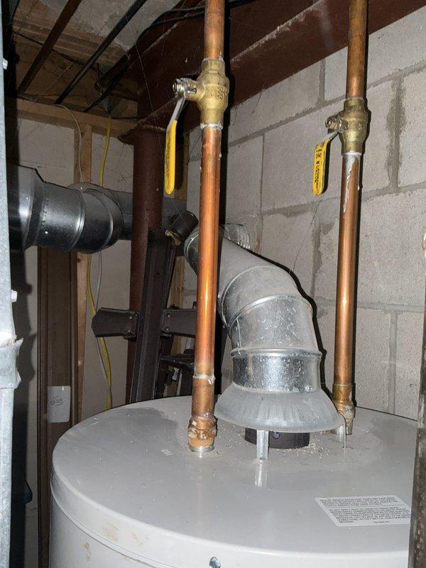 Completed PLUM Member Check Up on 1982 residential property. Performed comprehensive inspection and verification of 12-year-old Bradford White gas water heater (Model MI5036FEN, Serial LE34414761, installed May 2014). Verified proper operation of copper supply lines, brass shut-off valves, sediment trap assembly, and exhaust venting system. Documented equipment condition with photographic records showing water heater installation in basement utility area and exterior exhaust vent. All equipment confirmed operational with manufacturer warranty documentation on file.