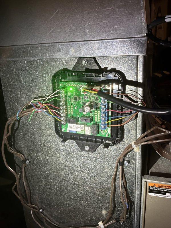 Responded to after-hours no cooling call on 2-year-old Armstrong Air system with complete loss of thermostat communication and system response. Upon arrival, diagnosed failed control board in air handler unit causing total system shutdown. Replaced defective control board, restored all electrical connections, and verified proper thermostat communication and system operation. Unit cycling normally with adequate cooling at time of departure.