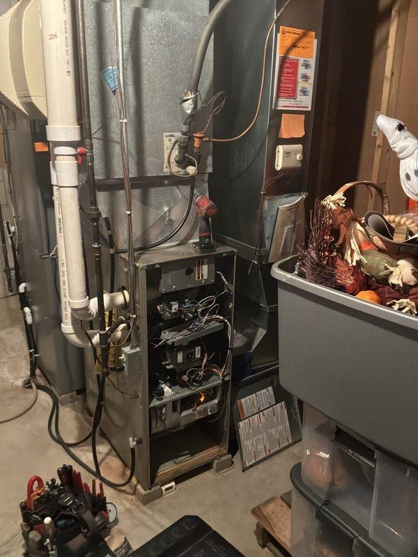 Completed comprehensive cooling system maintenance check on two HVAC systems including a 1987 Lennox HS16-411V-4P condensing unit (38 years old) and a 2006 Carrier 58UVB060-F-10114 furnace (19 years old). Performed full multi-point inspection on both systems, verified equipment operation, checked refrigerant levels, inspected electrical connections and controls, examined ductwork and airflow, and documented system conditions with photographic records. Both systems found operational with primary and secondary heat exchangers under active manufacturer warranty through 2047.