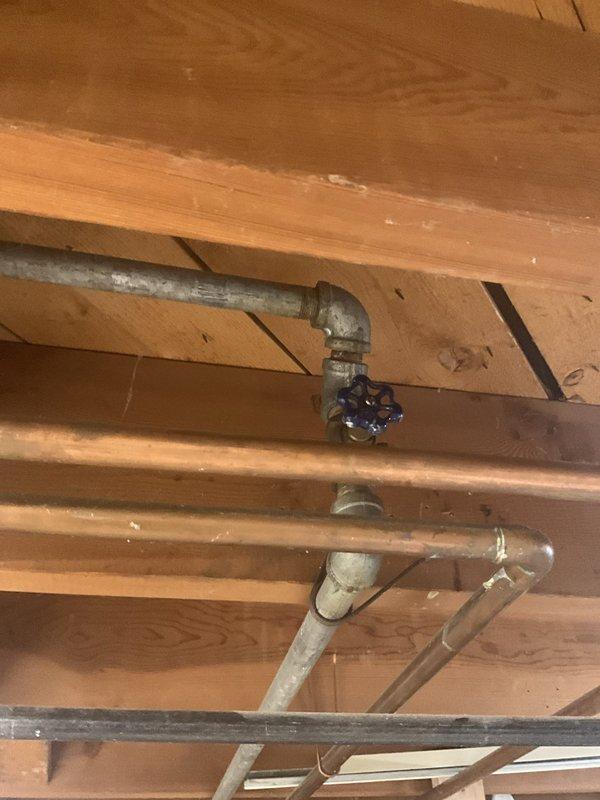 Responded to 1960s residential property for evaluation of exterior hose bibs requiring replacement. Inspected front and rear outdoor faucets and assessed feasibility of upgrading to frost-proof models. Evaluated interior shut-off valve serving rear spigot, which was found to be seized and inoperable, requiring replacement to restore proper isolation capability for the exterior plumbing fixture.