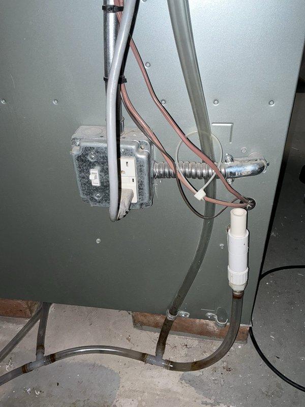 Conducted comprehensive evaluation of existing HVAC system for AC replacement and equipment relocation. Documented gas and electric meters for Focus on Energy rebate eligibility. Inspected basement-mounted natural gas furnace and ground-level air conditioning unit, photographing existing equipment conditions including internal wiring, refrigerant connections, and mechanical components. Assessed utility room layout and existing plumbing infrastructure to determine feasibility for proposed equipment relocation and replacement project.
