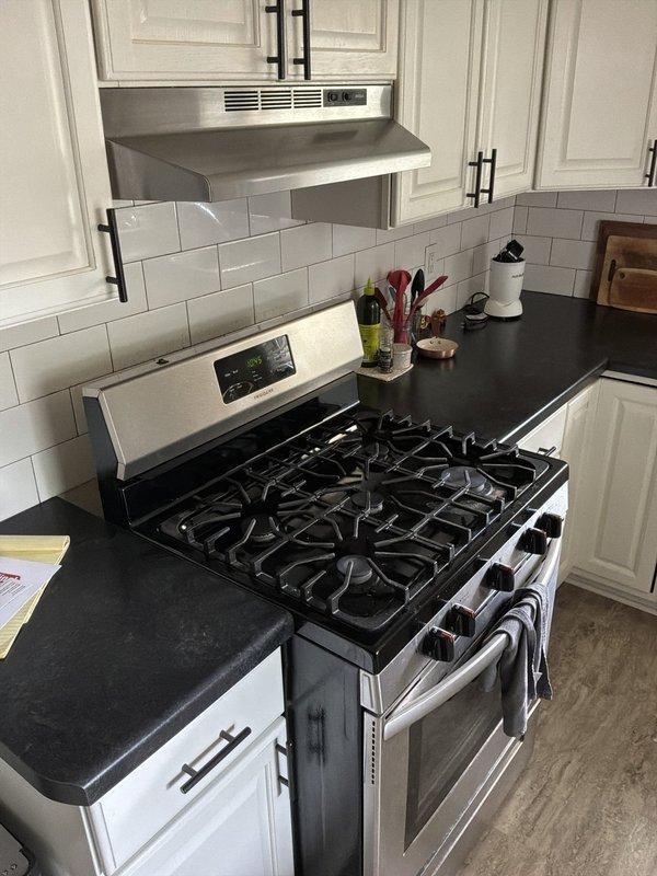 Madison, WI - Conducted electrical estimate for kitchen conversion from gas range to induction cooktop (GE Profile PHS700AYFS). Assessed existing electrical panel capacity and determined requirements for dedicated 240V circuit installation, including new breaker, appropriate gauge wiring from panel to kitchen location, and NEMA 6-50R or hardwired connection per appliance specifications. Evaluated gas line shutoff and capping requirements at current range location.