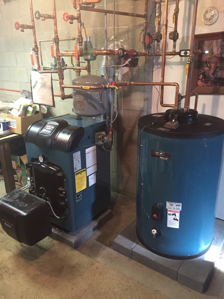 Heating oil fired Burnham boiler maintenance. Clean and service boiler. 
