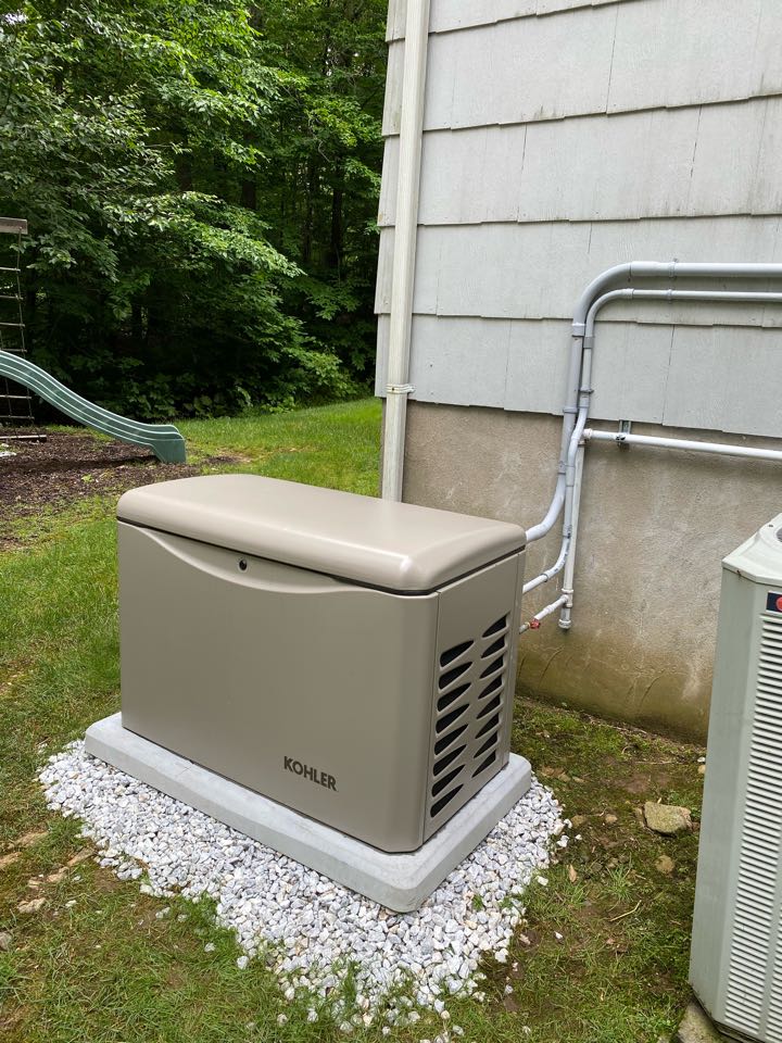 Installation of a Kohler automatic home back up generator with transfer switch.
