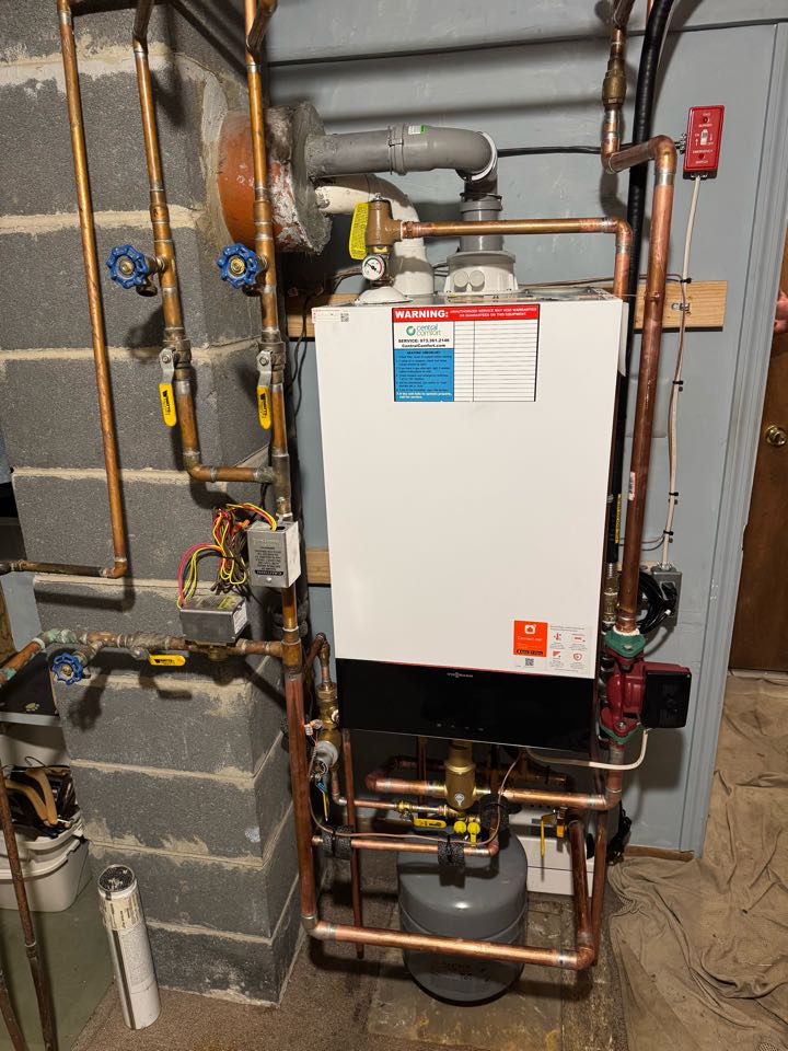 Oil two natural gas conversion of a high efficiency Viessmann Combi boiler. Run gas line from meter to boiler and barbecue.
